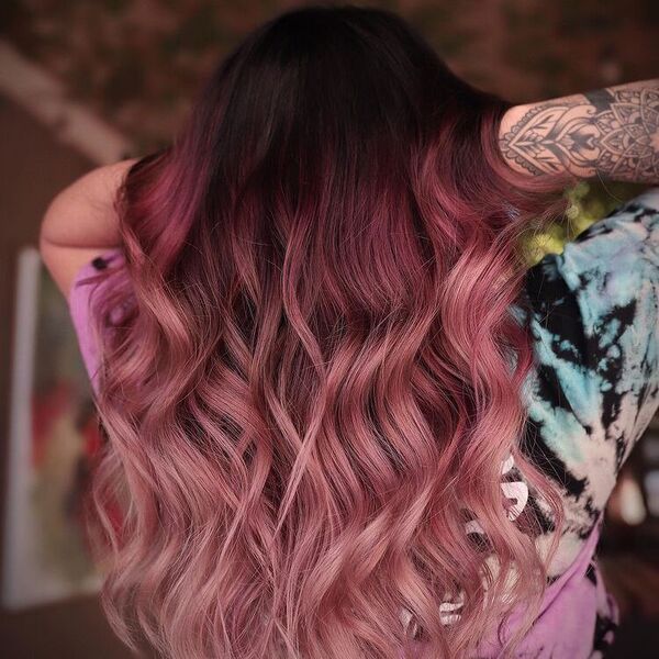 Iconic Purple Pink Color Melt Hair Tone - a woman wearing tie-dyed shirt with arm tattoo.
