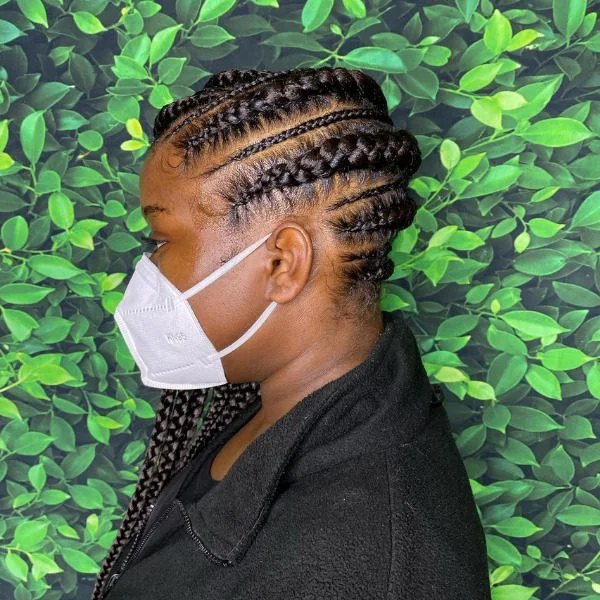 Large Lemonade Braided Hair - A woman wearing white mask