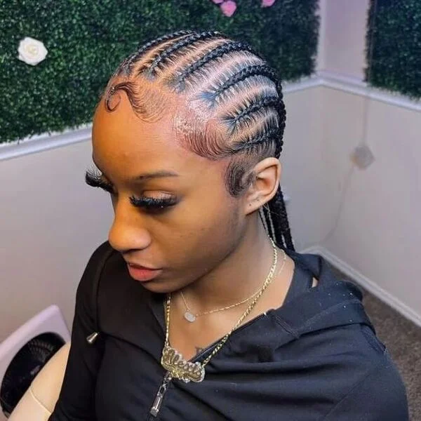 Lovely 10 stitched braids - a woman wearing a zipper down hooded jacket.