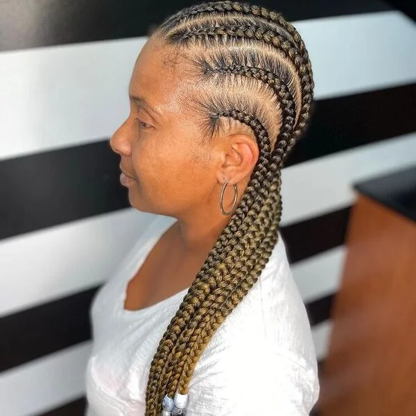 Mustard Feed in Braid Hairstyles with Weave - a woman wearing V-neck shirt.
