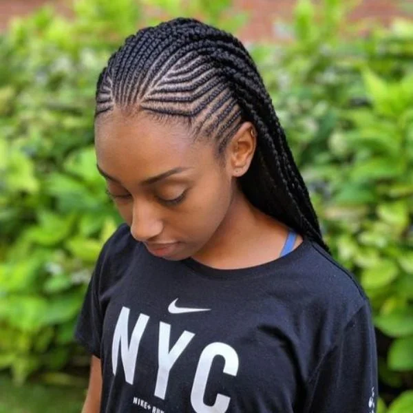 Neat Fulani Braided Hair - A woman wearing a black top
