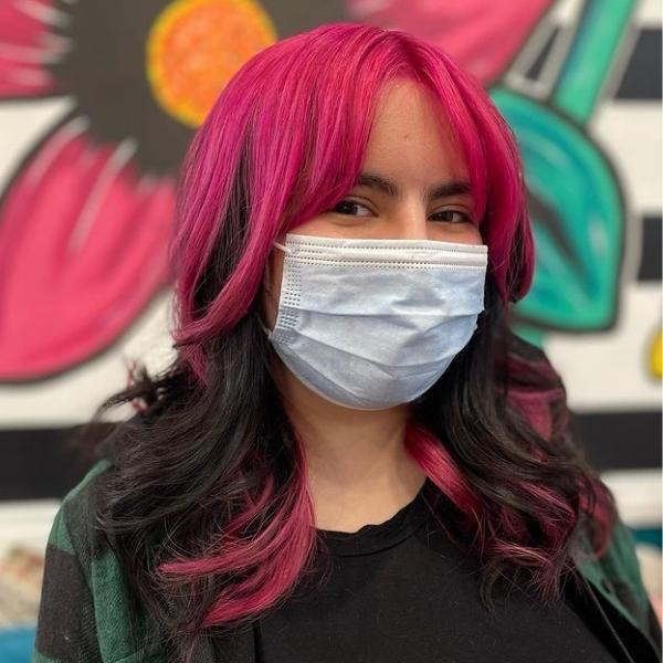 Pink Voluminous Wolf Cut - A woman wearing mask