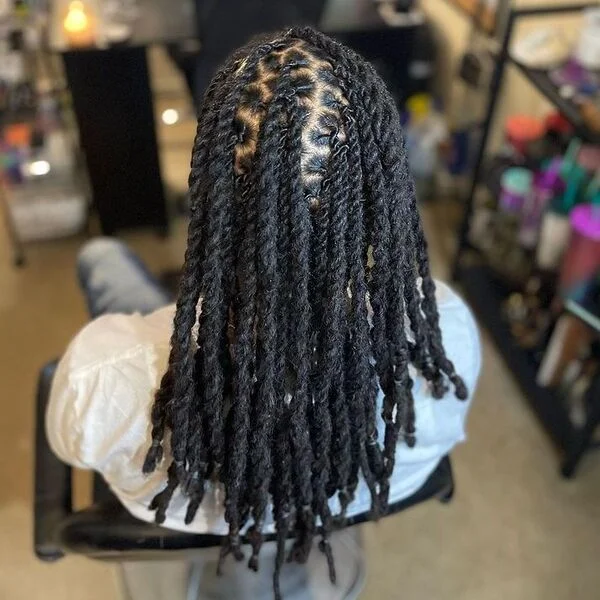 Re-twist Braid Hairstyles with Weave - a woman wearing white shirt.