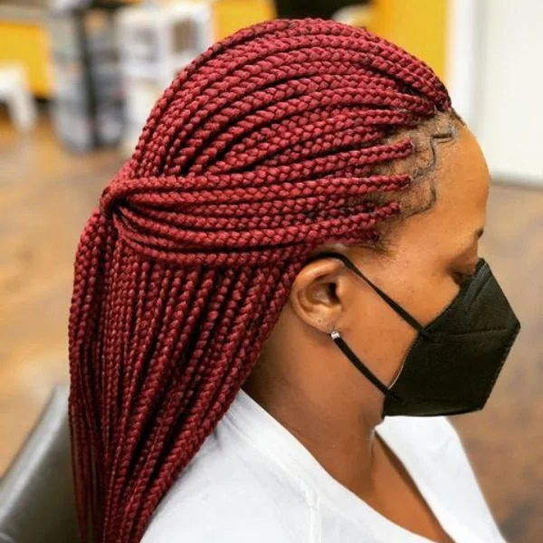 Red Micro Lemonade Braided Hair - A woman wearing a black mask