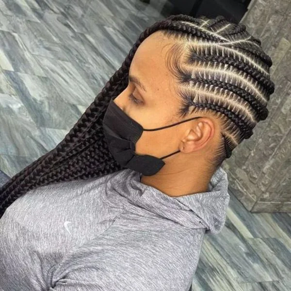 Side Ways Lemonade Braided Hair - A woman wearing a black mask