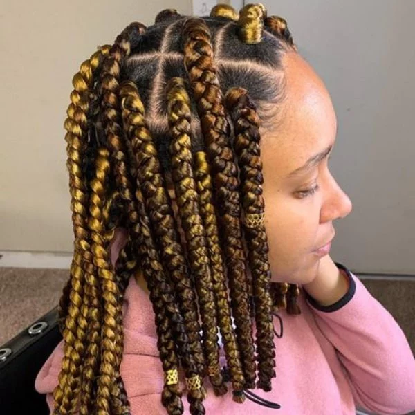Small Lemon Crochet Bob Cut Braids - A woman wearing a pink jacket