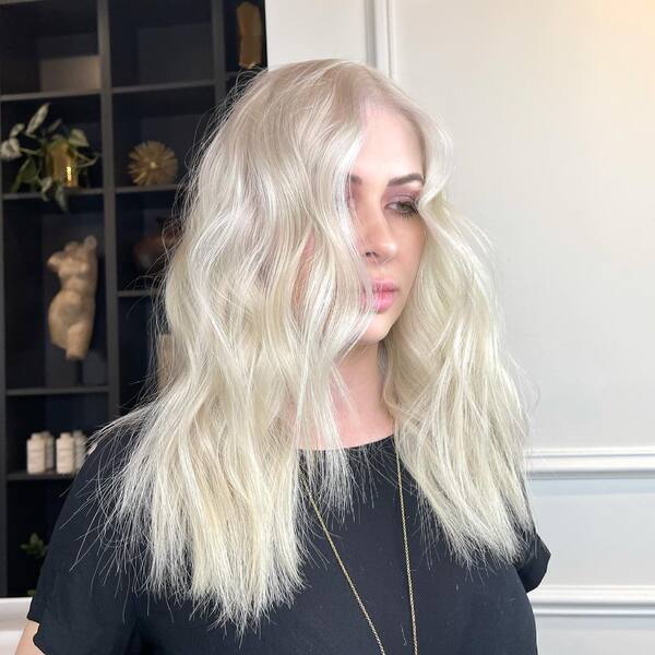 Soft Shag Platinum Blonde Hairstyle - A woman with make up