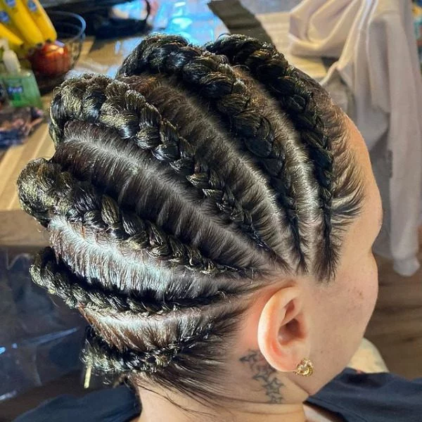 Stitch Lemonade Braided Hair - A woman with a tattoo