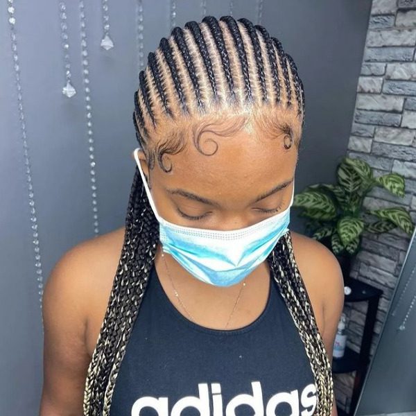 Swaggy Braided Hairstyle - A woman wearing a surgical mask