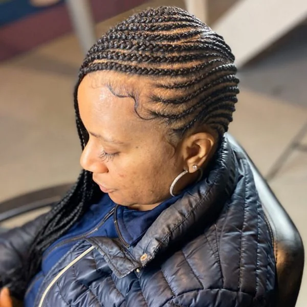 Tiny Lemonade Braids - A woman wearing a thick coat