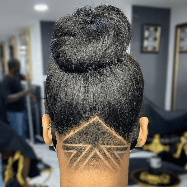 Triangle Undercut High Bun Hairstyle - A woman inside a salon