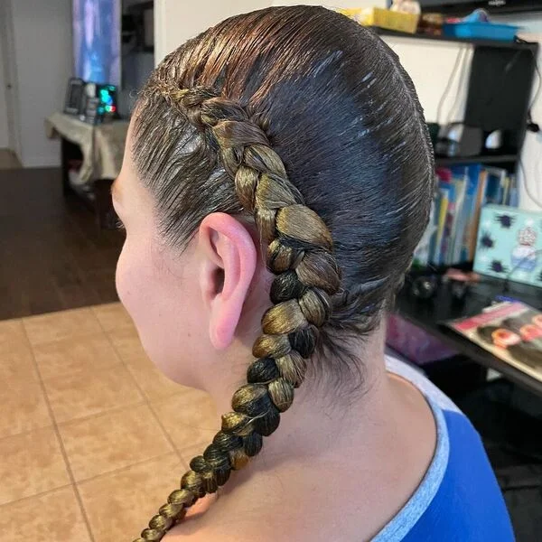 Two Braids Feed-in Hairstyle - a woman wearing two tone shirt.