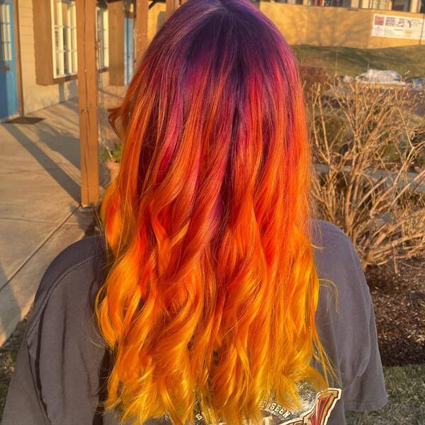 Wavy Sunset Ombre Hairstyle - A woman wearing a shirt