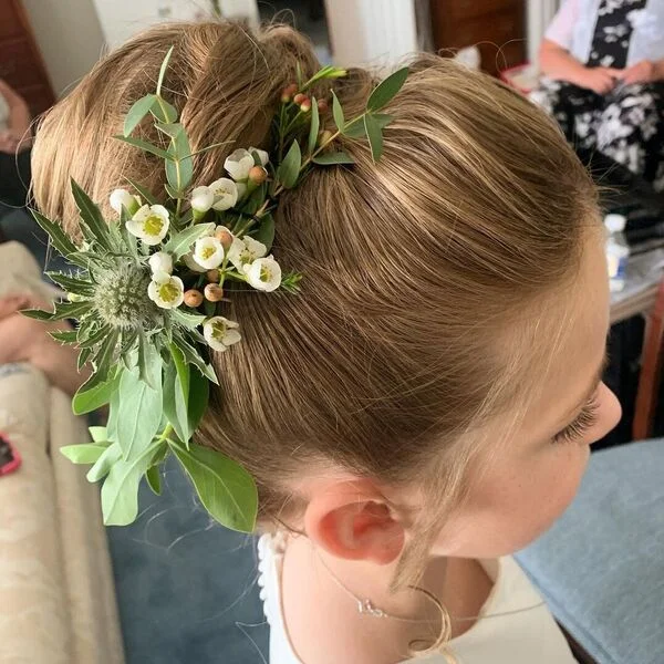 Beautiful Full Bun - a girl is wearing white dress.
