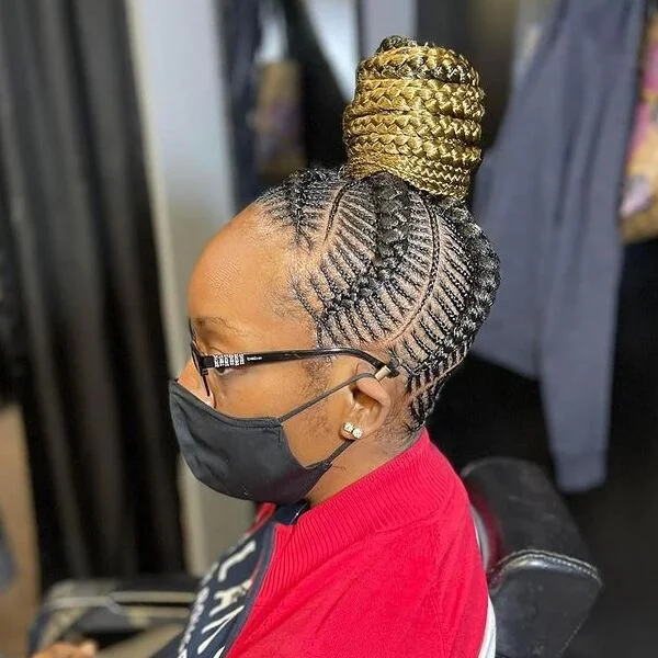 Big Bun Cornrow Fishbone Braid Hairstyles - a woman wearing black cotton mask and glasses.