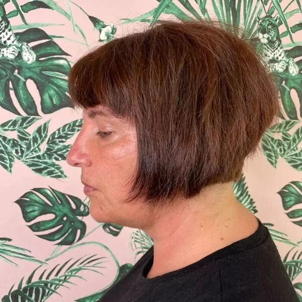 Blunt Bob - a woman wearing black shirt.