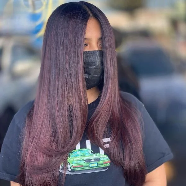 a woman wearing printed black shirt.