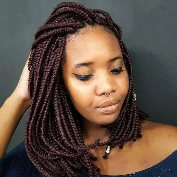 Burgundy Cornrow Braids - a woman wearing blue blouse.