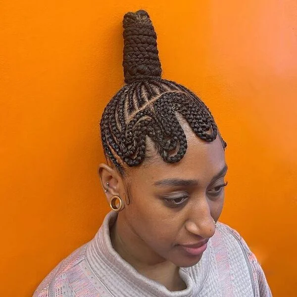 Cornrow Finger Wave Updo - a woman wearing long sleeves.