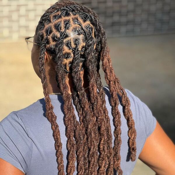 Dark Tone Twisted Long Locs - a woman wearing pastel purple shirt.