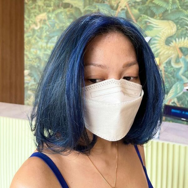 Deep Sapphire Blue Bob Highlights - a woman wearing blue tank top with mask and necklace.