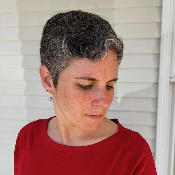 Gray pixie cut with finger wave bangs showing mature elegant styling
