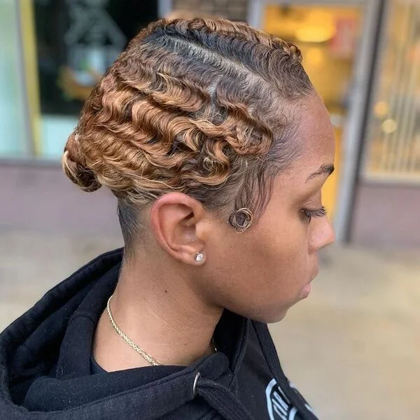 Finger Waves Braided Bun - a woman wearing jewelries in black hood jacket.