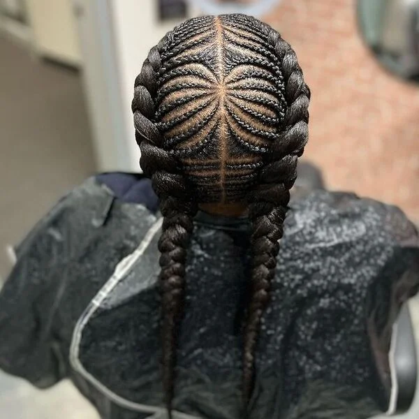 Fishbone with Intricate Designs - a woman wearing black barber cape.