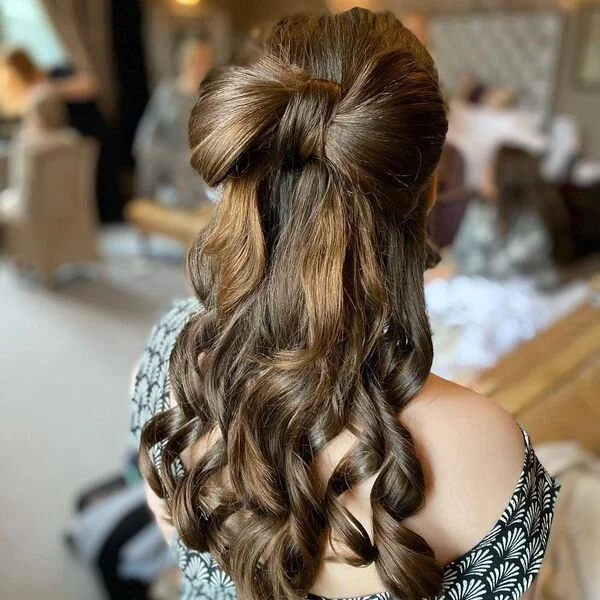 Flower Girl Bow Hairstyle - a girl is wearing black printed dress.