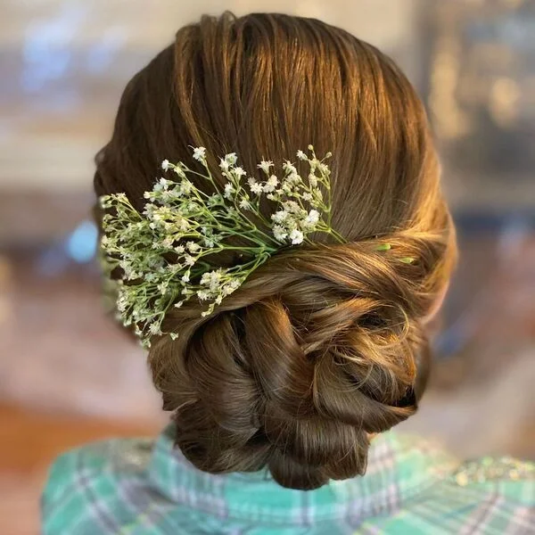 Inter Twine Big Bun Hairstyle - a girl is wearing green checkered polo.