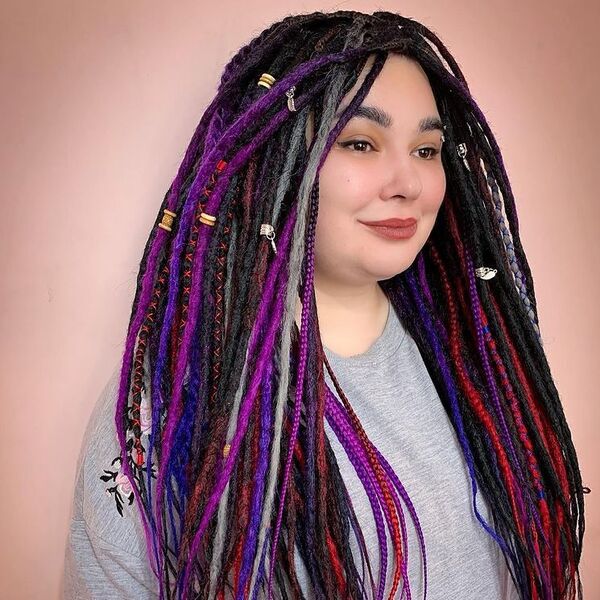 Knotless Colorful Dreads - a woman wearing loose gray shirt.