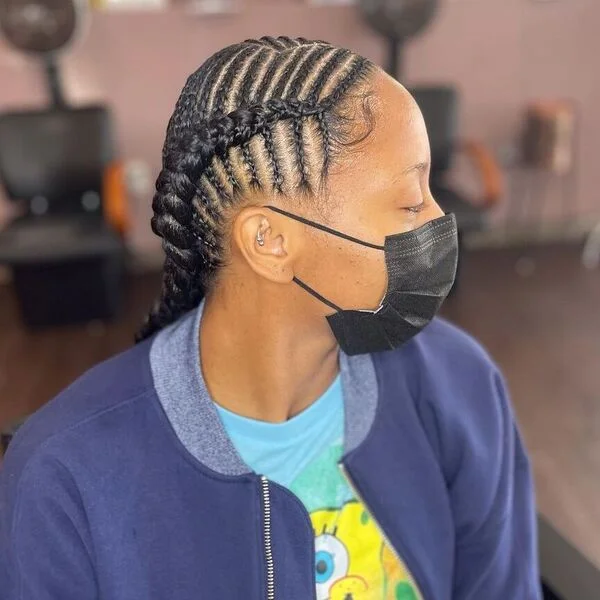 Knotless Feed-in Fishbone Braid Hairstyles - a woman wearing mask and jacket.