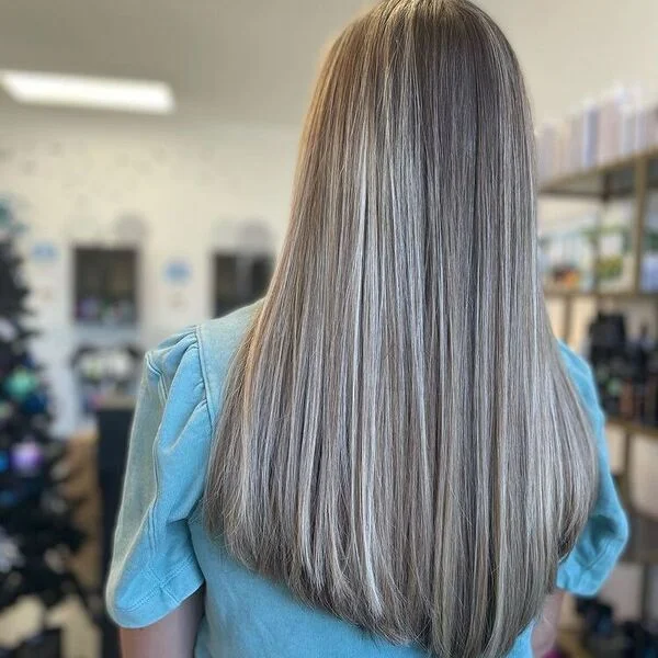 a woman wearing sky blue blouse.