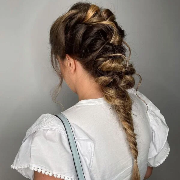 Messy two-tone fishbone braids showcasing contrasting colors in an effortless style