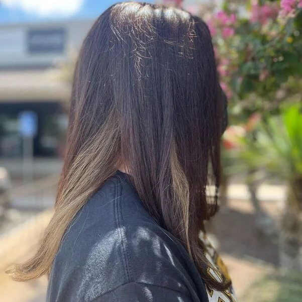 a woman wearing printed black shirt.