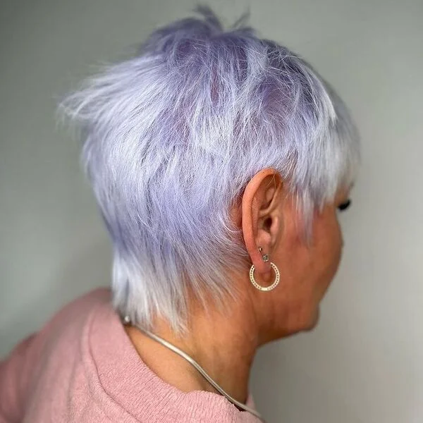 Purple Platinum Mullet - a woman wearing jewelries in pink top.
