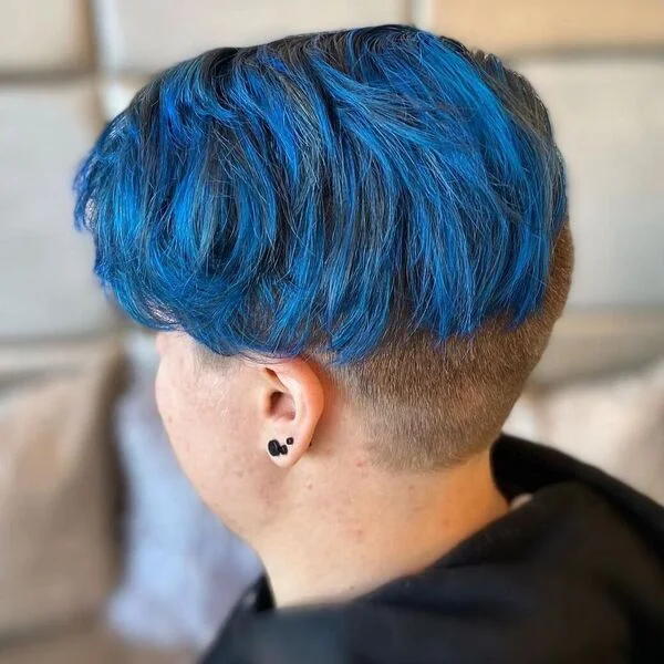 Shave Nape Blue Highlights - a woman wearing black hood jacket.