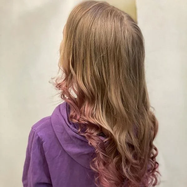 a woman wearing violet hood jacket with sheer Peekaboo Highlights for Brown Hair with pink touche