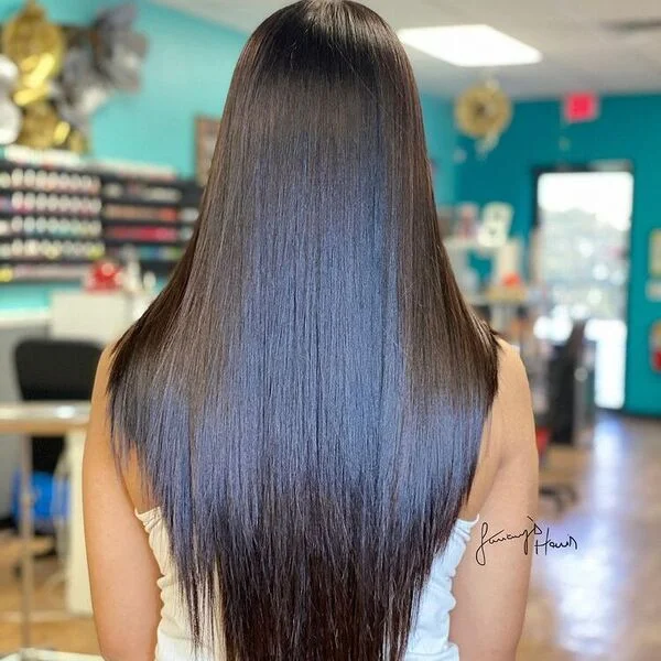 a woman wearing white single strap top.