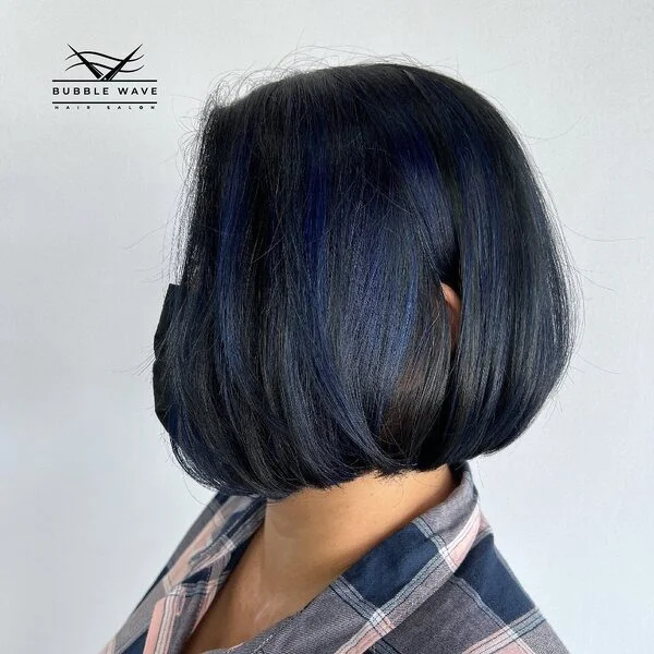 Short A-line Bob Hairstyles - a woman wearing checkered long sleeves.