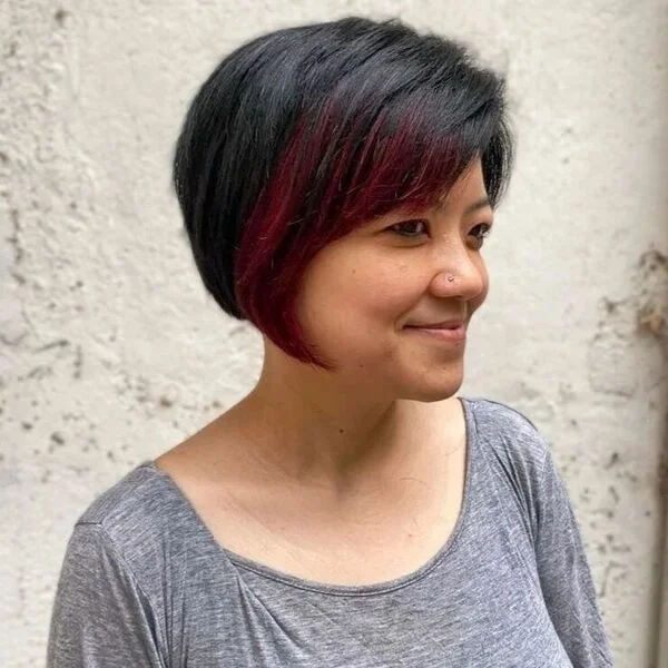 Short Bob with Red Tints - a woman wearing gray loose shirt.