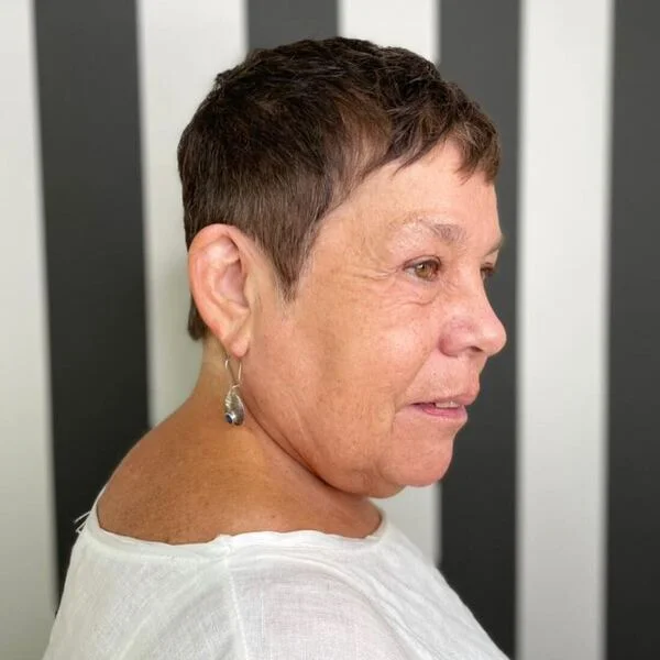 Short Pixie - a woman wearing plain white shirt.