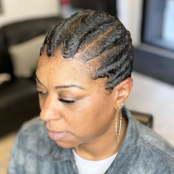 Side part line-up finger waves on short hair showcasing elegant vintage styling technique