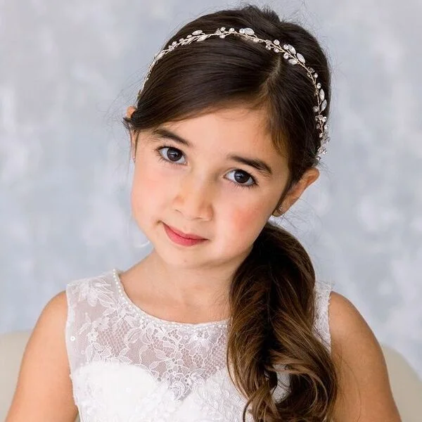 Simple Curly Ponytail - a girl is wearing sleeveless white gown.