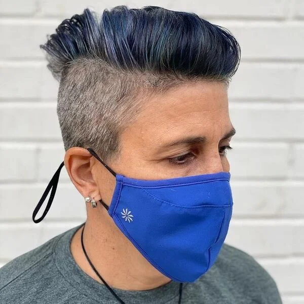 Slicked Blue Highlights Undercut - a woman wearing blue mask in gray shirt.