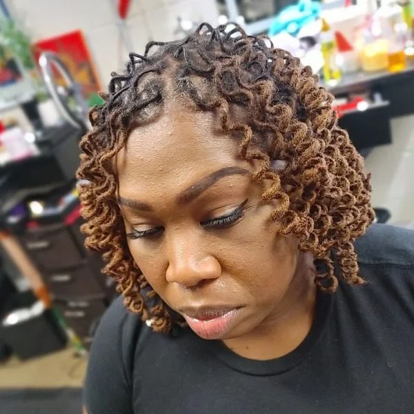 Spring Dreadlock Hairstyles for Women in Caramel Hue - a woman wearing black shirt.