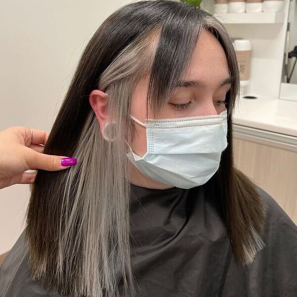 Straight Silver Peekaboo with Side Bangs - a woman wearing mask and black cape.