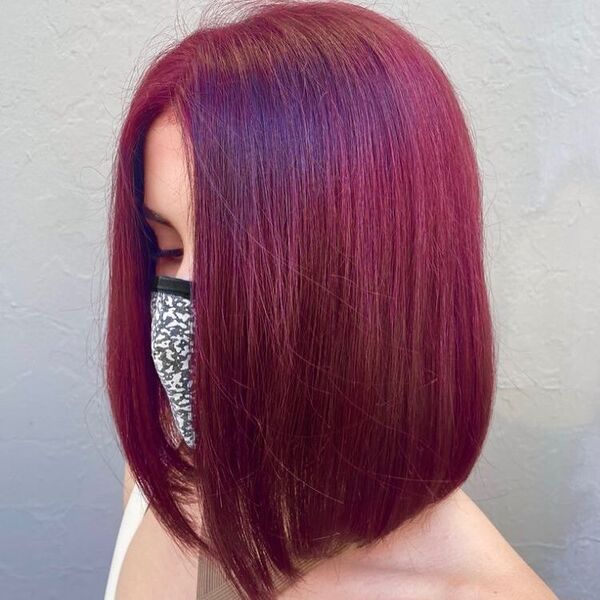 Stunning Straight Red Wine Bob - a woman wearing brown halter top.