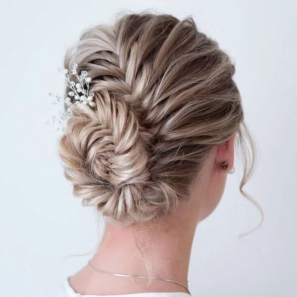 Elegant fishbone braid updo perfect for formal occasions and weddings