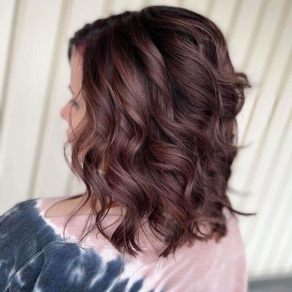 Subtle Burgundy in Curl Bob - a woman wearing dyed loose shirt.